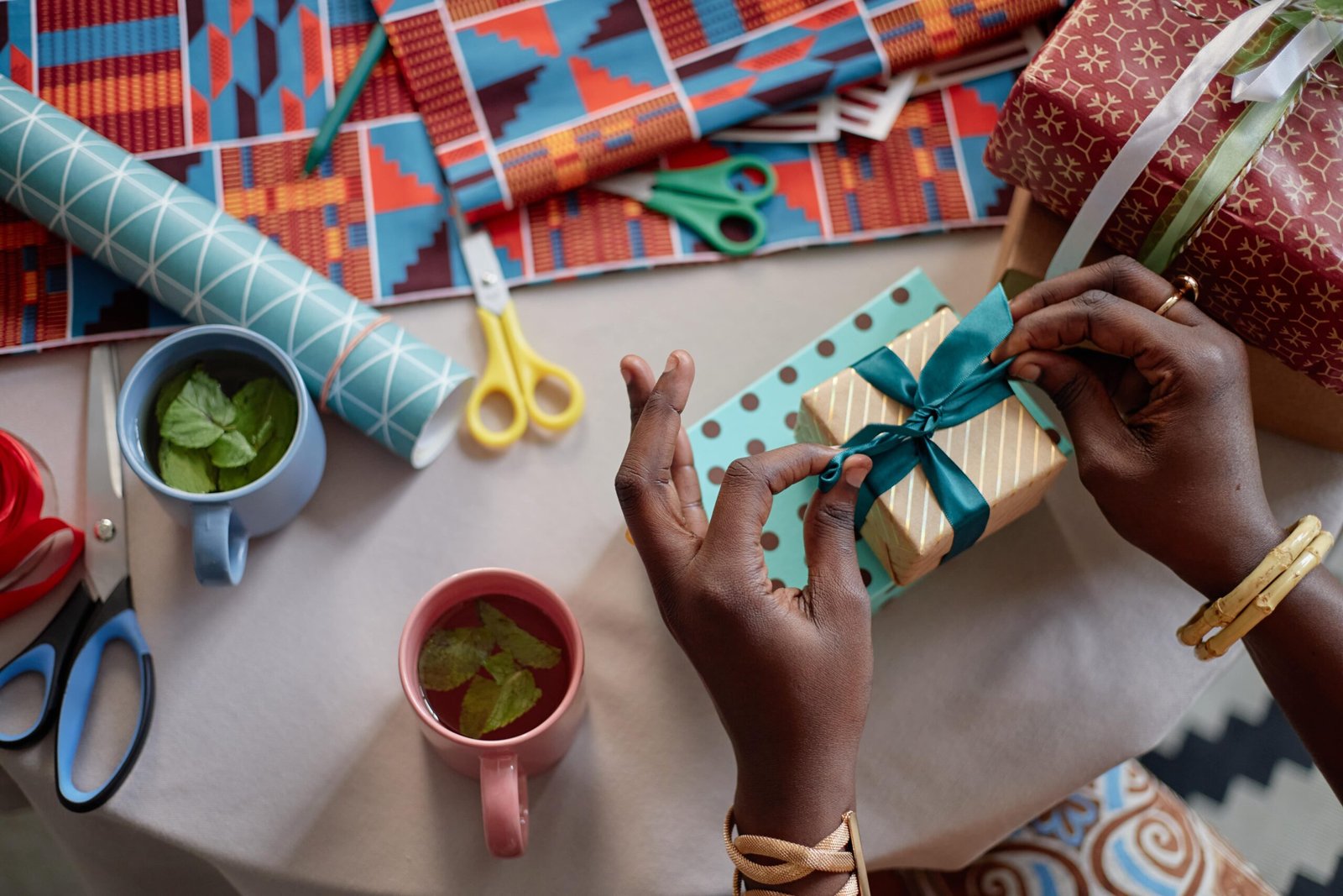 black-woman-wrapping-gift-box-with-ribbon-during-k-2025-09-30-22-29-04-utc (1)-min