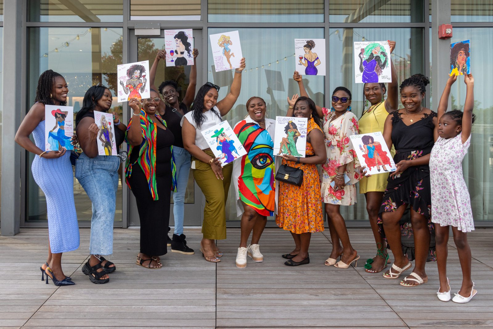 Paint Your Vision guests celebrating with their artwork