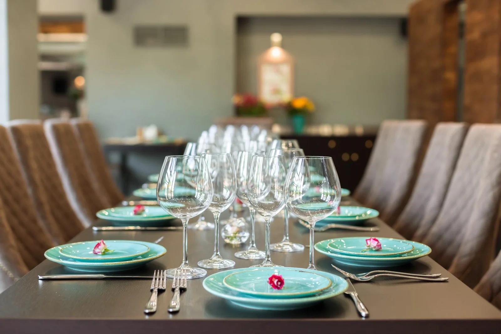 Turquoise place settings arranged for a SYSY Services event