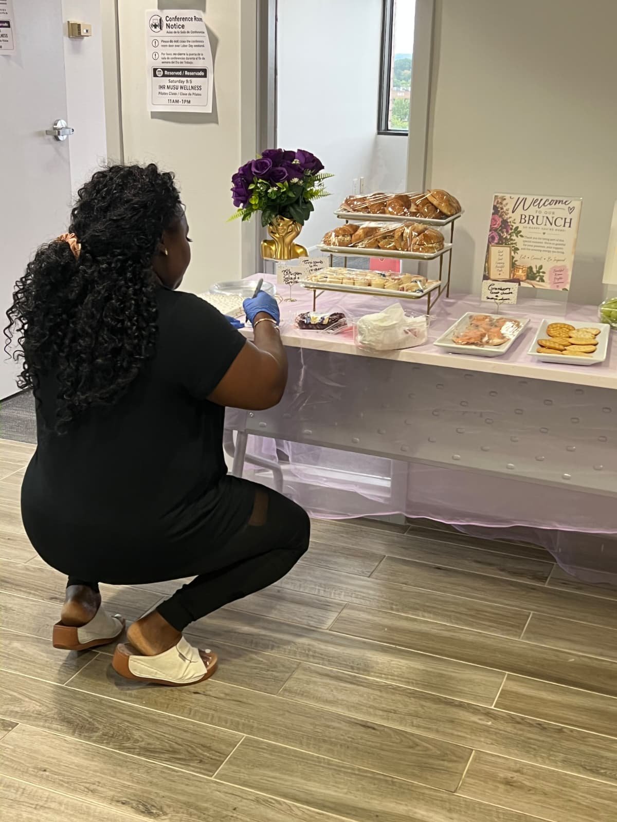 SYSY Services preparing a welcoming brunch display