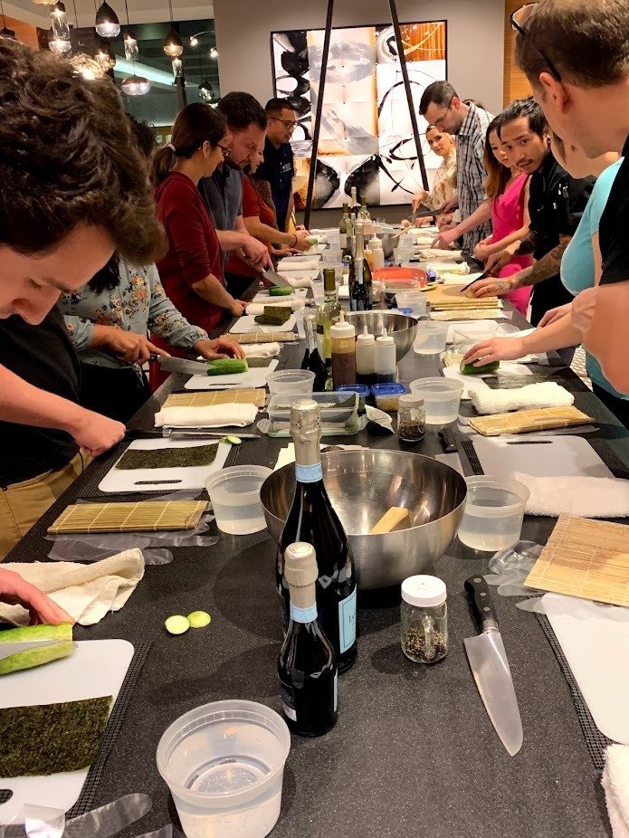 Guests participating in an interactive community cooking workshop